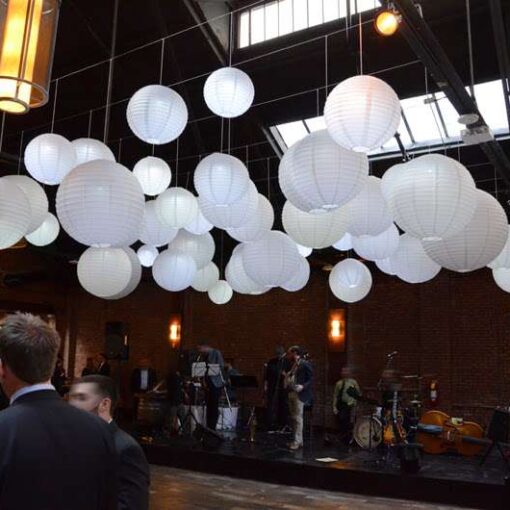 A cluster of White Paper Lanterns hanging above the dancefloor for a wedding at 26 Bridge (Brooklyn, NY)