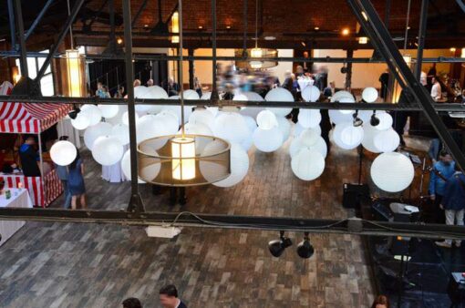 A cluster of White Paper Lanterns hanging above the dancefloor for a wedding at 26 Bridge (Brooklyn, NY)