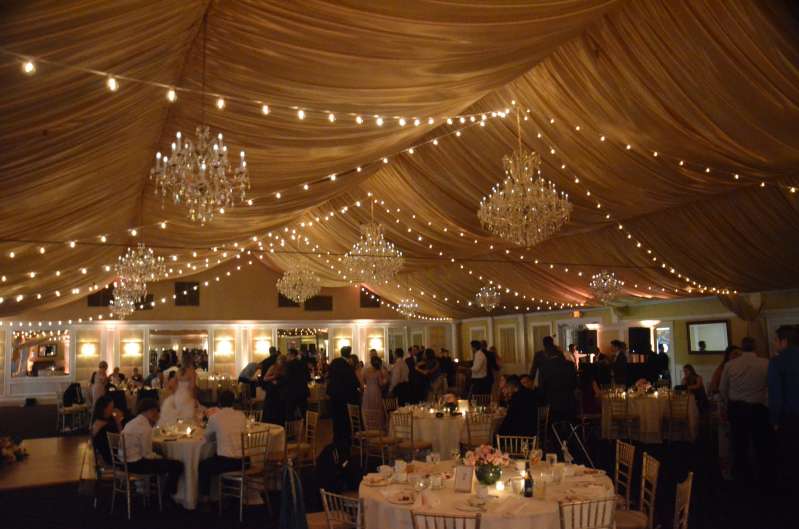String Lights hanging in a zigzagging pattern for a wedding at The Bridgeview Yacht Club. (Island Park, NY).