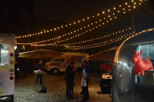 String Lights above the courtyard at The Foundry with out a tent or lighting stands.