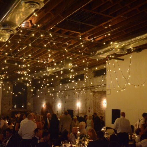 String Lights hanging over dance floor for a wedding at 99 Scott