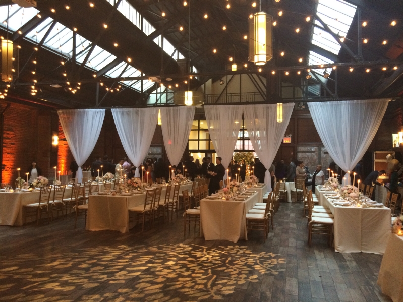 26 Bridge (Brooklyn, New York) - 600ft of String Lights suspended with G50 bulbs in a Circular Pattern above clients dance floor with a white shear partitioning curtain with a Textured floral wash projected on dance floor