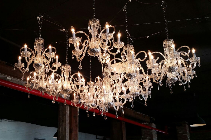 Chandeliers suspended over dance floor at The Liberty Warehouse