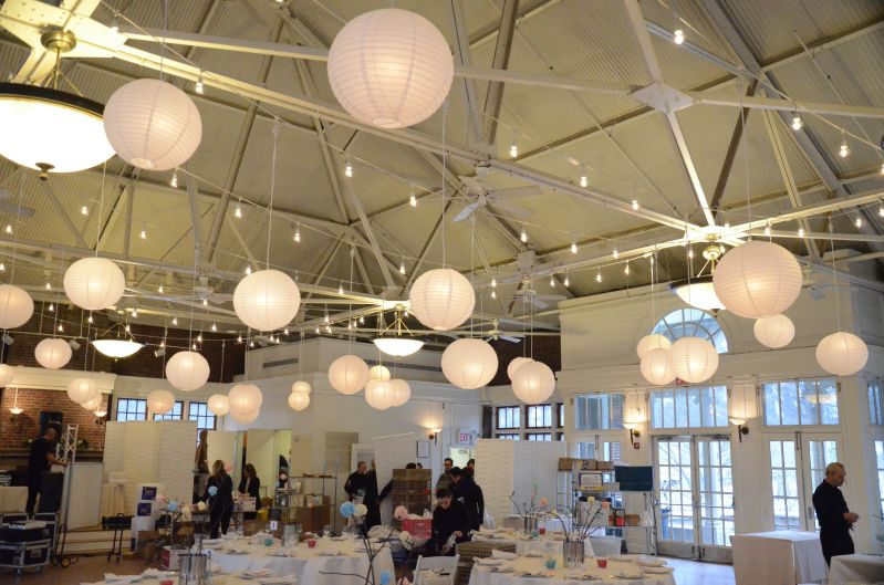 String Lights with white papter lanterns suspended in parallel lines for a wedding at The Prospect Park Picnic House located in Brooklyn, New York