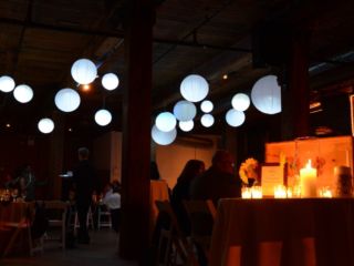 The Dumbo Loft (Brooklyn, New York) - Paper Lanterns suspended between the center columns with a decorative LED Light placed inside each lantern