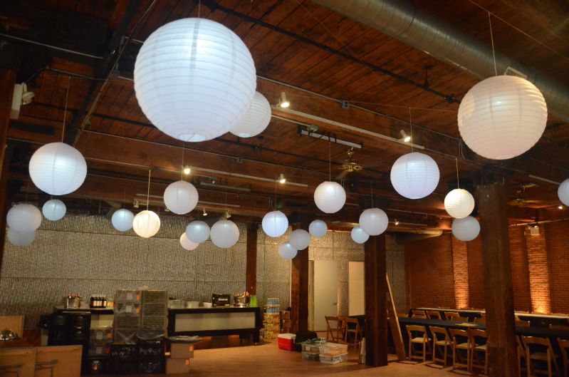 The Dumbo Loft (Brooklyn, New York) - Paper Lanterns suspended between the center columns with a decorative LED Light placed inside each lantern