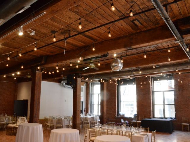 The Dumbo Loft (Brooklyn, New York) - String Lights suspended in a zigzagging pattern between center columns