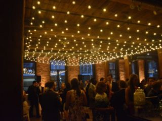 The Dumbo Loft (Brooklyn, New York) - String Light with G50 Bulbs suspended as a canopy between the center columns at The Dumbo Loft with Up-Lights along the perimeter walls