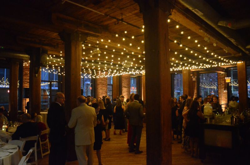 The Dumbo Loft (Brooklyn, New York) - String Light with G50 Bulbs suspended as a canopy between the center columns at The Dumbo Loft with Up-Lights along the perimeter walls