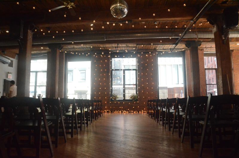 The Dumbo Loft (Brooklyn, New York) - String Lights suspended Vertically as a backdrop behind ceremony with String Lights suspended in a zigzagging pattern between center columns