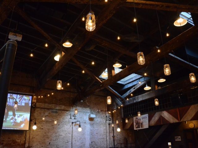 The Houston Hall (New York, NY) - String Lights suspended with Mason Jars and S14 bulbs in a V-Shaped pattern