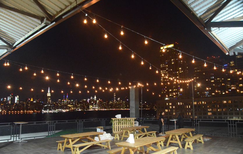 The W-Loft (Brooklyn, New York) - String Lights suspended from stands above outdoor patio