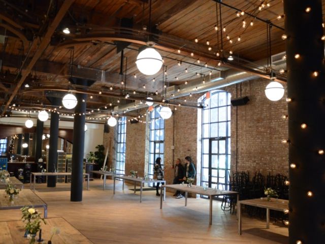 The Wythe Hotel (Brooklyn, New York) - String Lights suspended over head in V-Shaped Pattern with a column wrapped in lights