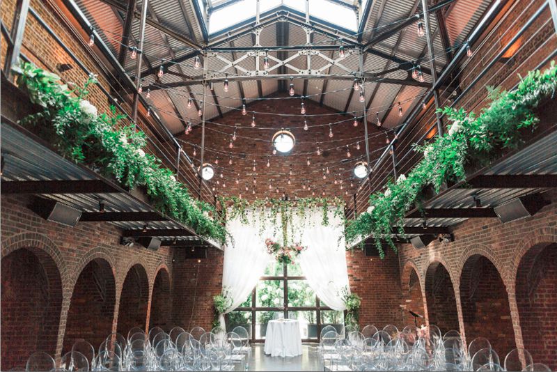 300ft of String Lights suspended with S14 bulbs in the main room at The Foundry - Wedding Lighting