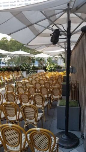 Spotlights for a wedding ceremony at The Bryant Park Grill on The Rooftop Terrace in New York City
