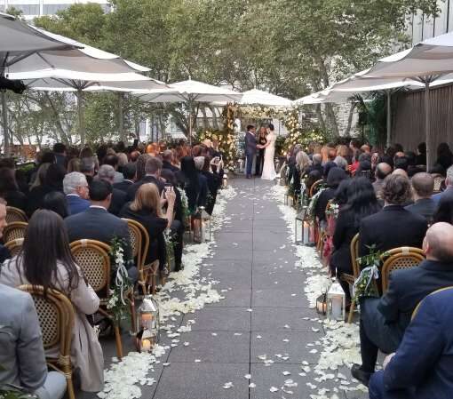 Spotlights for a wedding ceremony at The Bryant Park Grill on The Rooftop Terrace in New York City