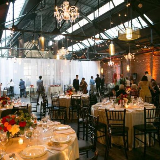 Crystal Chandeliers with String Lights hagging in a zigzagging pattern for a wedding at 26 Bridge (Brooklyn, NY)
