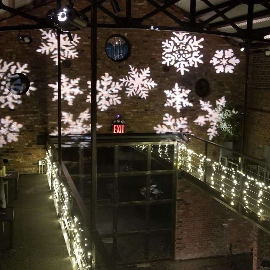Stock Snowflake Gobos and Vertical cascading String Lights for a holiday party in the main room at The Foundry