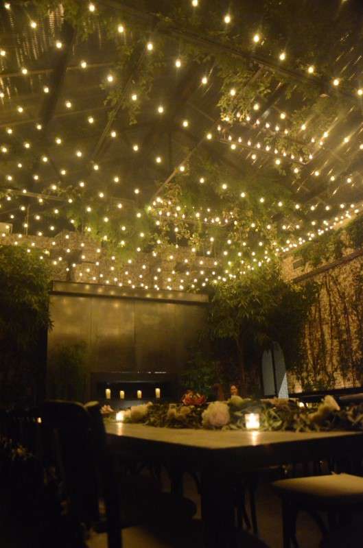 A canopy of Warm White String Lights with round G50 bulbs hanging in The Greenhouse for a wedding at The Foundry.