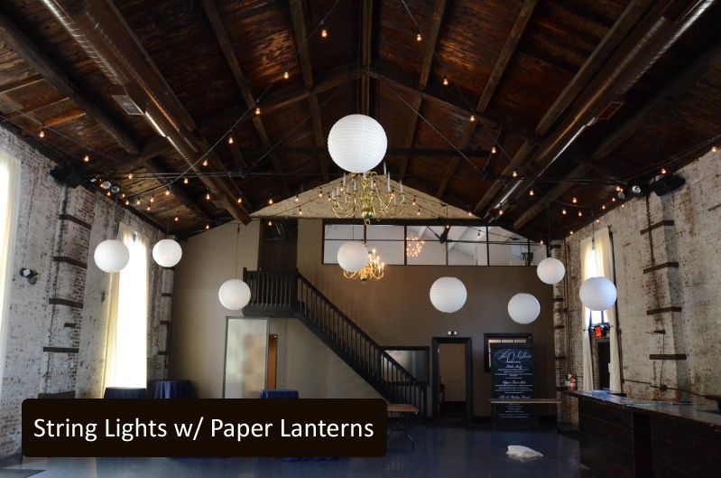 String Lights suspended overhead with paper lanterns at The Green Building located in Brooklyn, New York