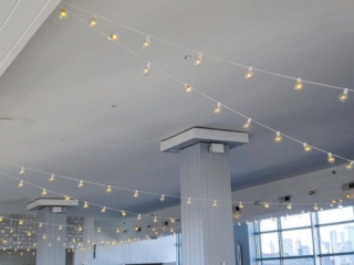 String Lights with round G50 bulbs suspended overhead for a wedding at The W-Loft located in Brooklyn, New York