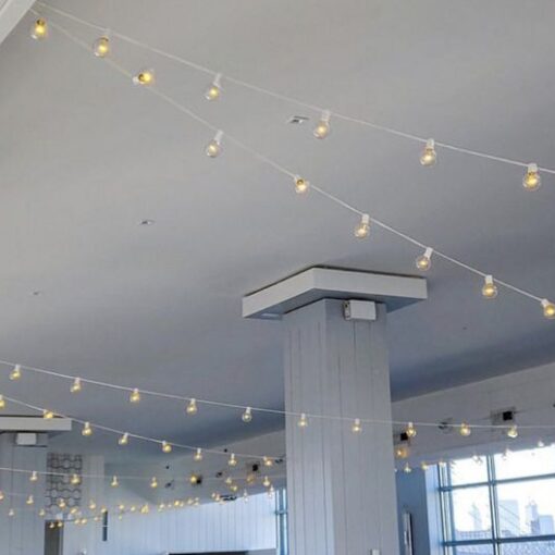 String Lights with round G50 bulbs suspended overhead for a wedding at The W-Loft located in Brooklyn, New York