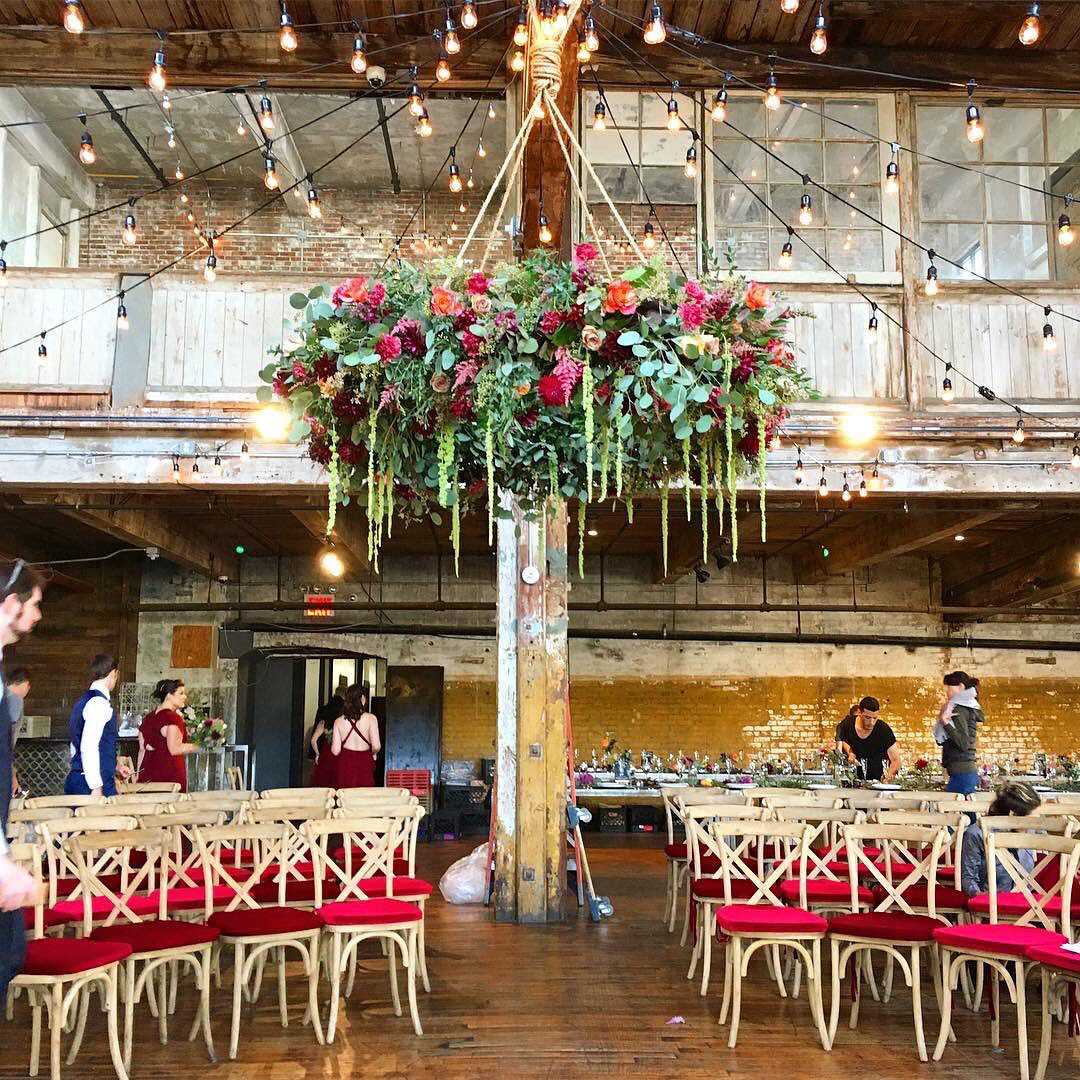 String Lights with floating floral installation The Greenpoint Loft located in Brooklyn, New York