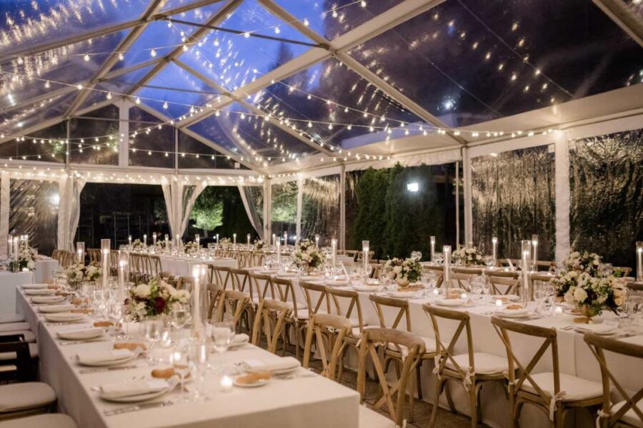 String Lights hanging outdoors under a clear top tent for a wedding at The Foundry