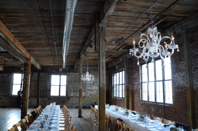 Crystal chandeliers suspended under lower ceiling area at The Greenpoint Loft located in Brooklyn, New York