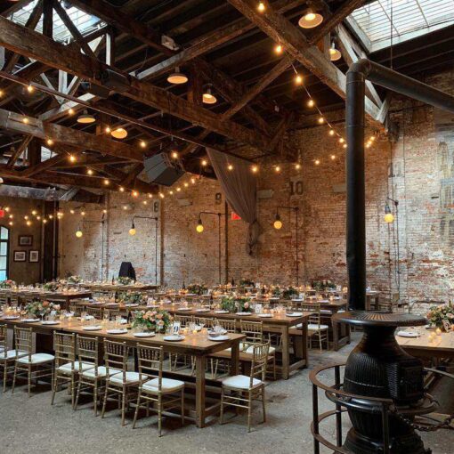String Lights hanging above the main room for a wedding reception at The Houston Hall located in New York City