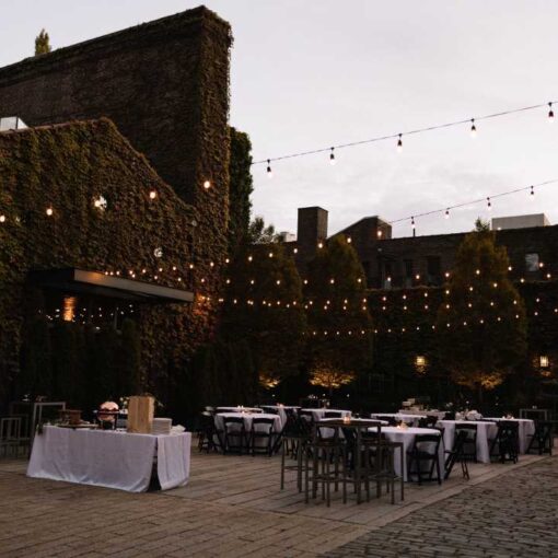 String Lights hanging over the rear courtyard for an outdoor wedding reception at The Foundry.