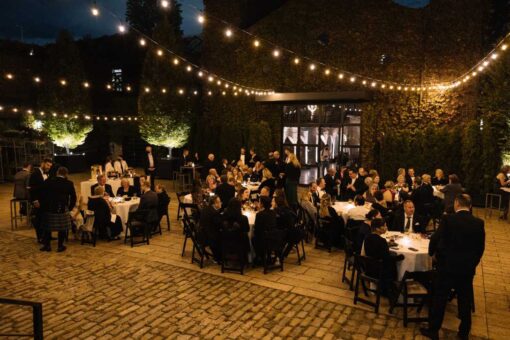 String Lights hanging over the rear courtyard for an outdoor wedding reception at The Foundry.