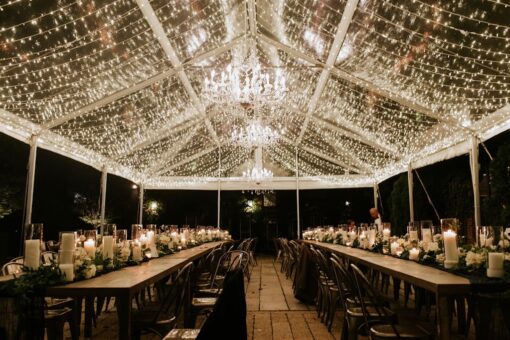 Icicle / Fairy Lights with Crystal Chandelier suspended under a clear top tent for a summer wedding at The Foundry.