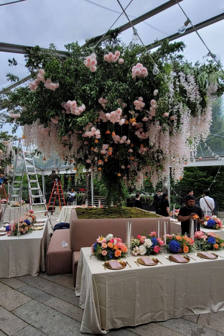 The Foundry (LIC, NY) Wedding Lighting - Large Floral Arrangement under a clear top tent
