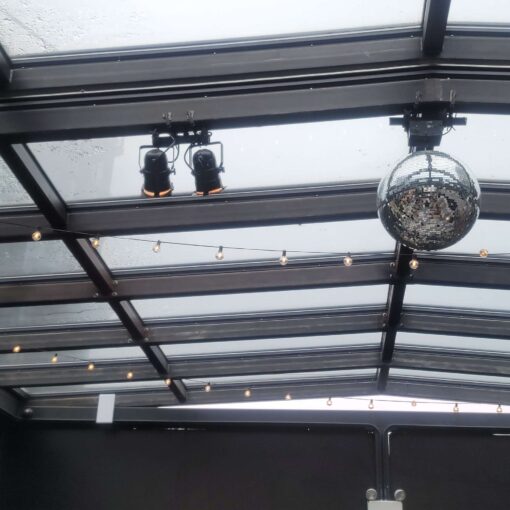 74Wythe (The Rooftop Deck) - Warm White Lighting for the performance area of a wedding band. Also, a mirror ball with a motor.