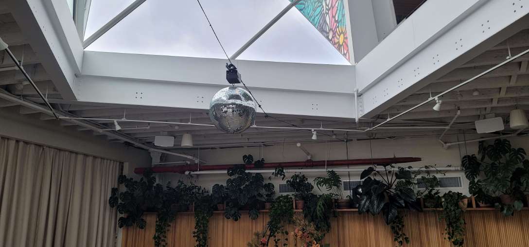 Mirror Ball Hanging Under Skylight for a Wedding Reception at Rule of Thirds (Brooklyn, NY)