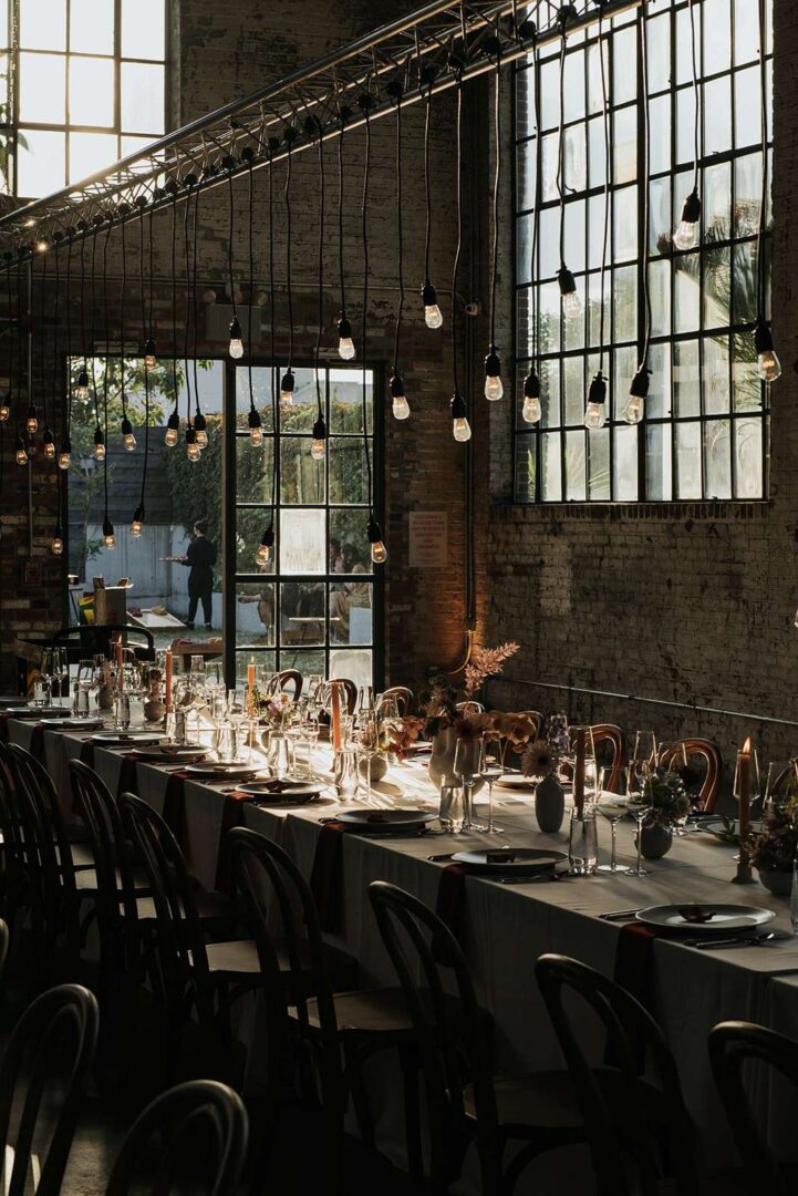 Pendant Lamps suspended over dinner tables for a wedding at 99 Scott