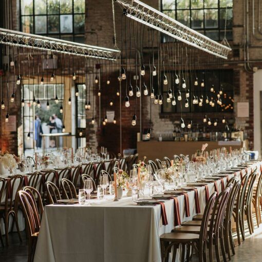 Pendant Lamps suspended over dinner tables for a wedding at 99 Scott