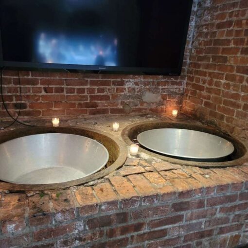 Votive Candles around the metal bowls near the bathrooms at The Foundry