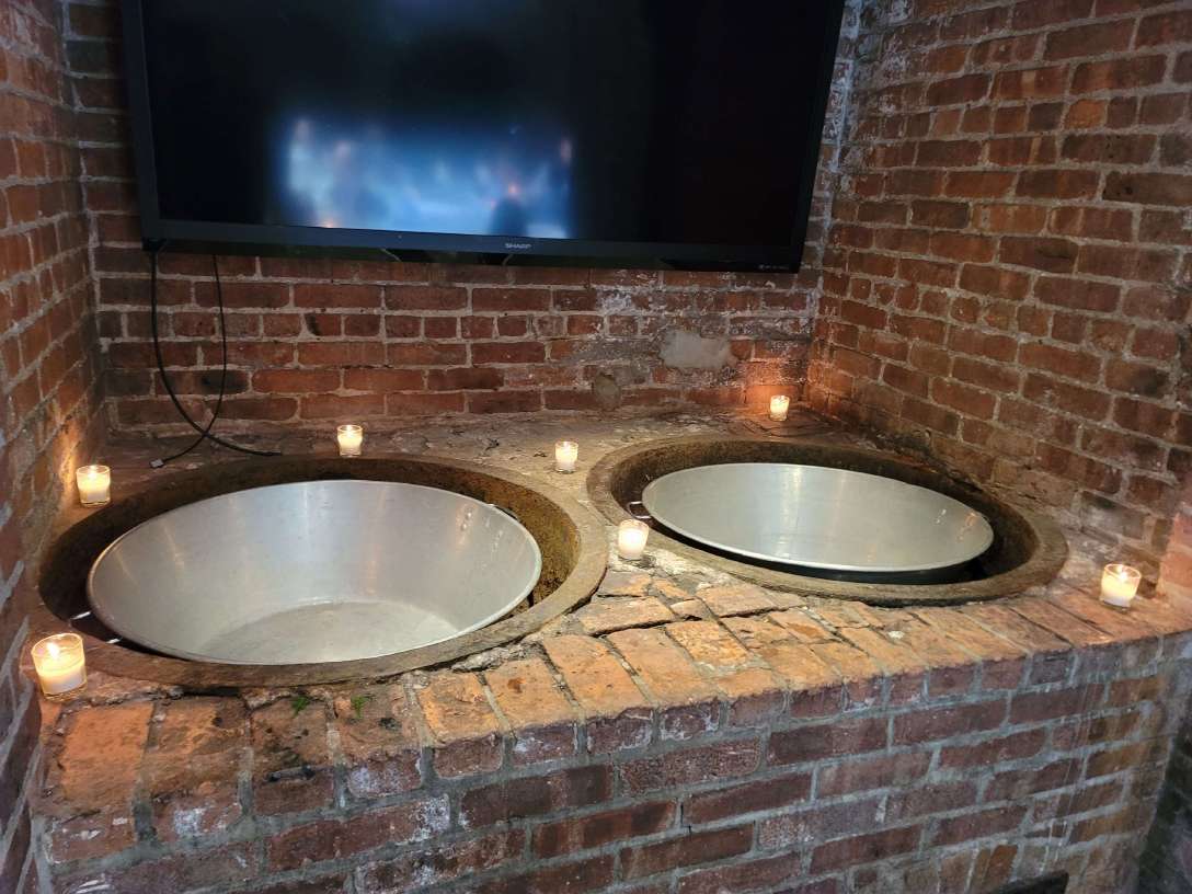 Votive Candles around the metal bowls near the bathrooms at The Foundry
