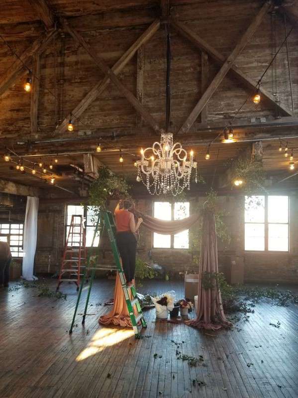 A Wedding with Chrystal Chandeliers and String Lights at The Greenpoint Loft in Brooklyn, NY.