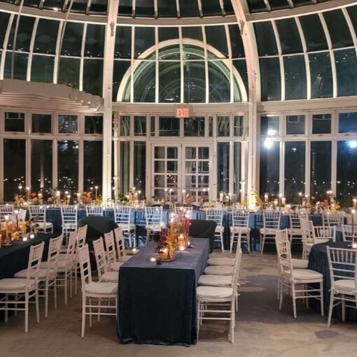 Warm White Up-lighting at the base of each column for a wedding in The Palm House in The Brooklyn Botanical Garden