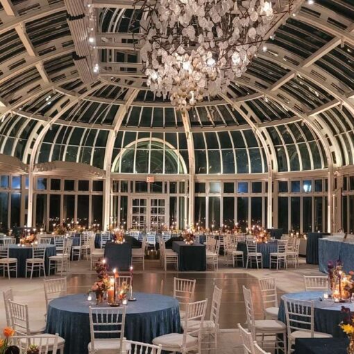 Warm White Up-lighting at the base of each column for a wedding in The Palm House in The Brooklyn Botanical Garden