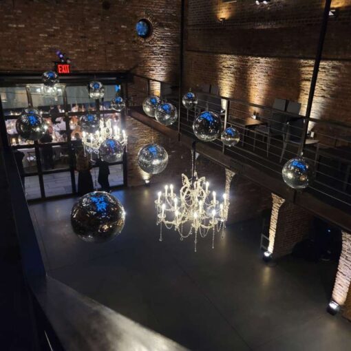 Crystal chandeliers, mirror balls, and Up-Lights along the perimeter walls 0f the main room at The Foundry