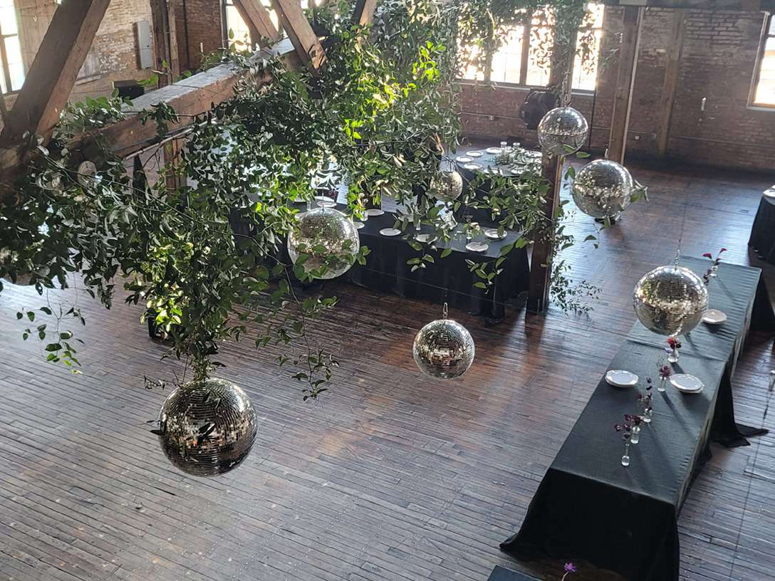 A cluster of disco balls at a wedding reception hosted at The Greenpoint Loft in NYC.