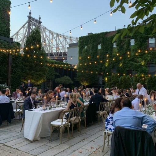 String Lights with Warm White bulbs suspended without lighting stands above the courtyard for a wedding at The Foundry.