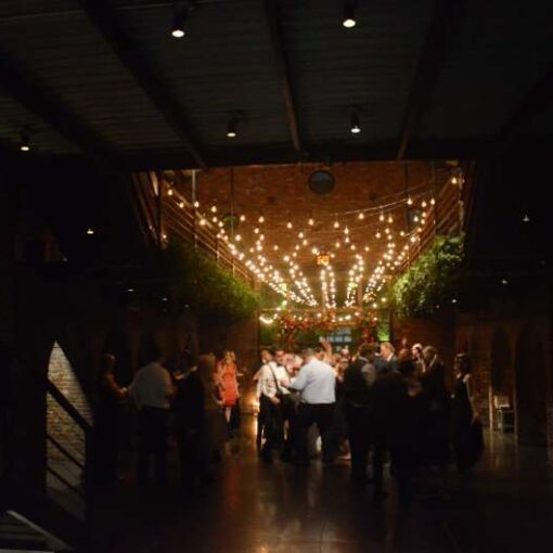 String Lighting with Warm White bulbs suspended in the main room for a wedding at The Foundry.