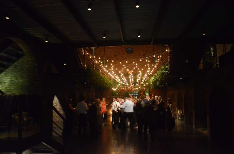 String Lighting with Warm White bulbs suspended in the main room for a wedding at The Foundry.