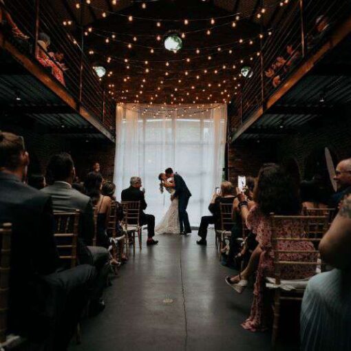 A canopy of String Lights with warm white G50 bulbs suspended in the main room for a wedding at The Foundry in Long Island City, NY.