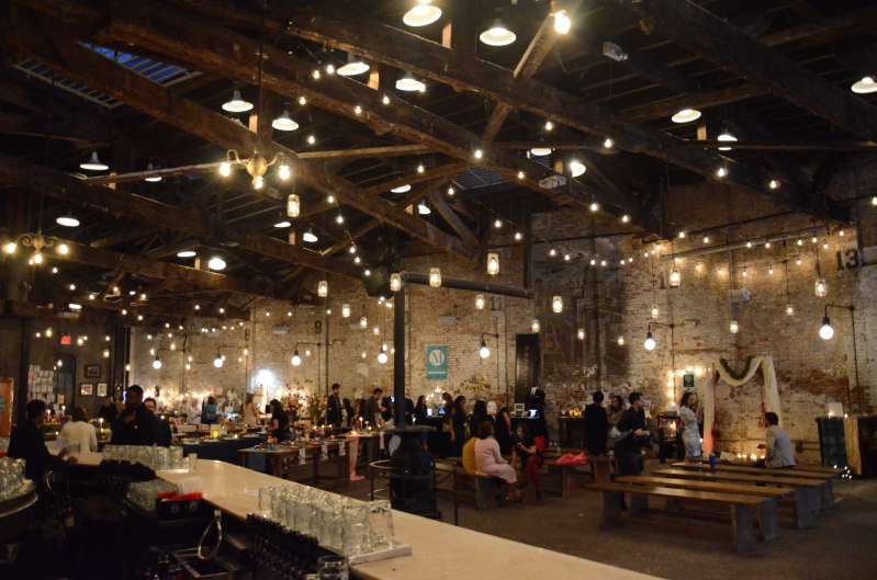 Warm White String Lights with Mason Jars Pendant Lamps hanging above the dance floor for a wedding at The Houston Hall